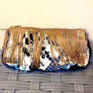 Elegant mixed print, beaded and sequin fringe clutch bag by Radalamal